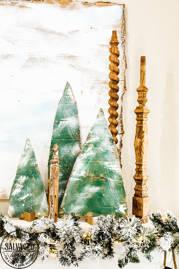 Decorate your mantel with these budget friendly ideas this Christmas! Plus I have a great tip on how to hang garland without nails for damage free decorating! This simple cardboard craft rounds out the Christmas fireplace decorations! #DamageFreeHolidayDecor #CommandDoNoHarm #cardboarddecor #fireplacedecor #vintageChristmas #budgetgarland #easyChristmasdecor 