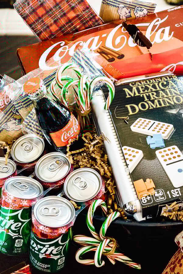 The ultimate list of family games for a family game night gift basket. The perfect gift for a family with tweens and teens plus extra gift ideas to tuck into your basket for the perfect party at home for a family with kids at Christmas. #JoinTheFizztivities #christmasgift #familygamenight #holidaygiftidea #teengift 