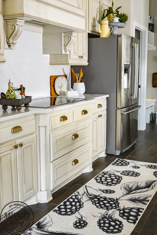 We LOVE our new machine washable rug for the kitchen. This Ruggable Rug in a berry print adds whimsical fun to our kitchen, is stain resistant and stays in place. You can see a video of how our new kitchen rug runner is the best kitchen rug for us on the blog! #kitchenrug #washablerug #affirdablerug 