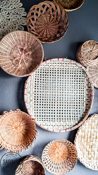 everything you need to know about creating basket gallery wall art. Where to find vintage baskets, how to hang baskets and how to layout a basket gallery wall are all here in this gorgeous gallery wall trend idea. #vintagedecor #wovenbaskets #basketwall #gallerywall