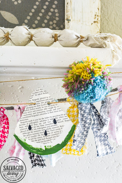 Make this DIY watermelon garland for your summer decor. This budget friendly summer craft is perfect for a summer mantel or summer tablescape! #summerdecor #summercraft #watermelondecor