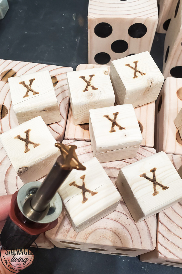 Learn how to make a DIY tic tac toe game from 4 X 4 posts that is so gorgeous you will want to display it, inside or out. This pretty tic tac toe board makes a perfect DIY gift, budget friendly! #tictactoe #woodproject #scrapwood