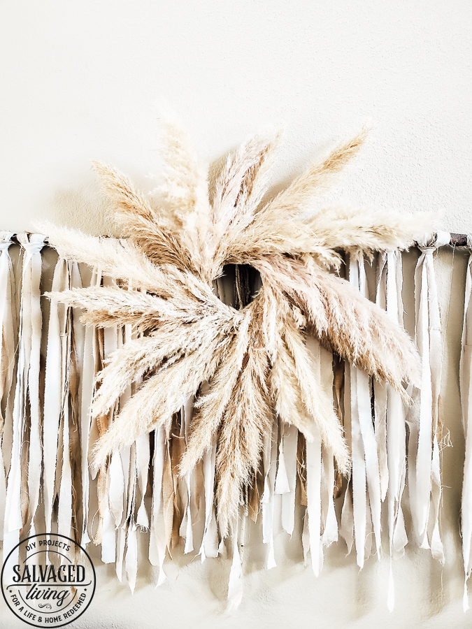 Learn how to make your own Pampas Grass Wreath, this DIY tutorial is easy to follow and perfect for gorgeous fall home decor. A Pampas Grass Wreath adds luxurious beauty to your living room or mantel for a boho chic look that only nature decor can provide! #pampasgrasslivingroom #wreathmaking #wreathtutorial #decoratingwithnature