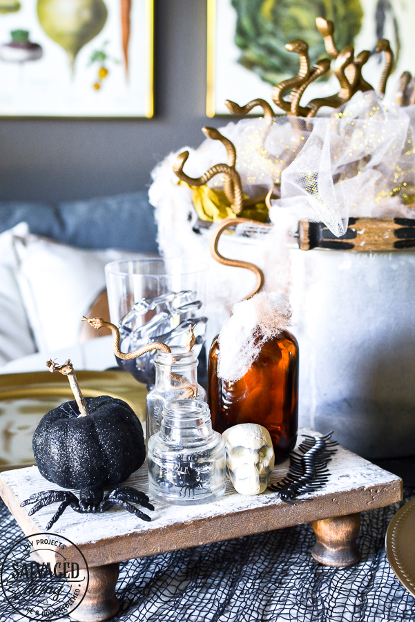 Create a fun Halloween tablescape with dollar stores supplies with these great Halloween decorating tutorials that are budget friendly for your holiday decorating! #halloweentable #dollarstoreHalloween #budgetHalloweenDecor