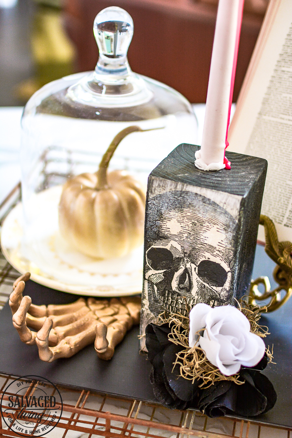 Easy DIY Halloween decor idea that you can craft in minutes. Use this DIY Halloween home decor as a candlestick, shelf sitter, Halloween vignette or table decor idea. Dollar store supplies are perfect for this Halloween idea to make budget friendly Halloween home decorating! #halloweencraft #Halloweenvignette #dollarstorehalloween