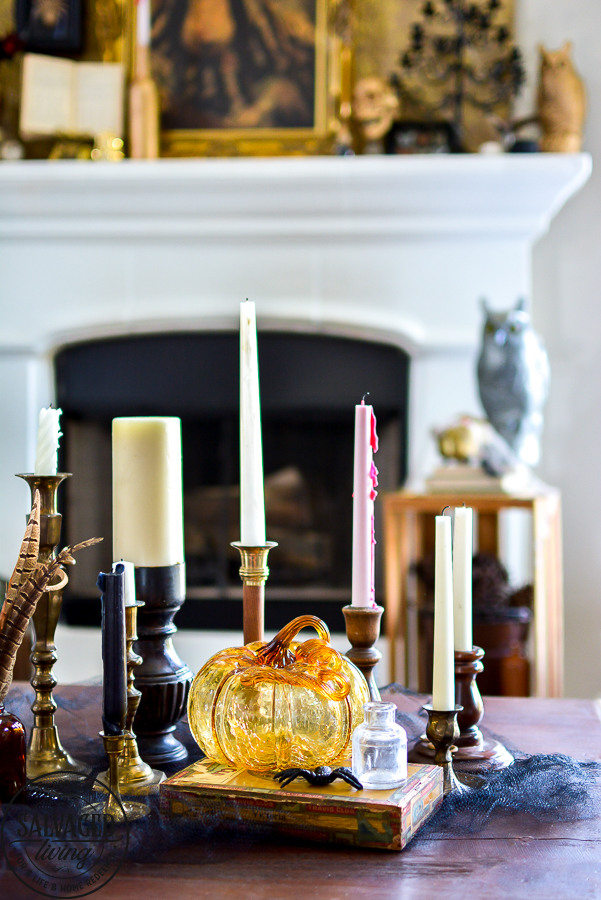 welcome to the Haunted Midas Mansion. These easy DIY Halloween mantel decoration ideas will inspire you to create an elegant Halloween home decor aesthetic that is a little bit vintage, kind of spooky and tons of fun. #indoorHalloween #Halloweendecorating #goldHalloweendecor 