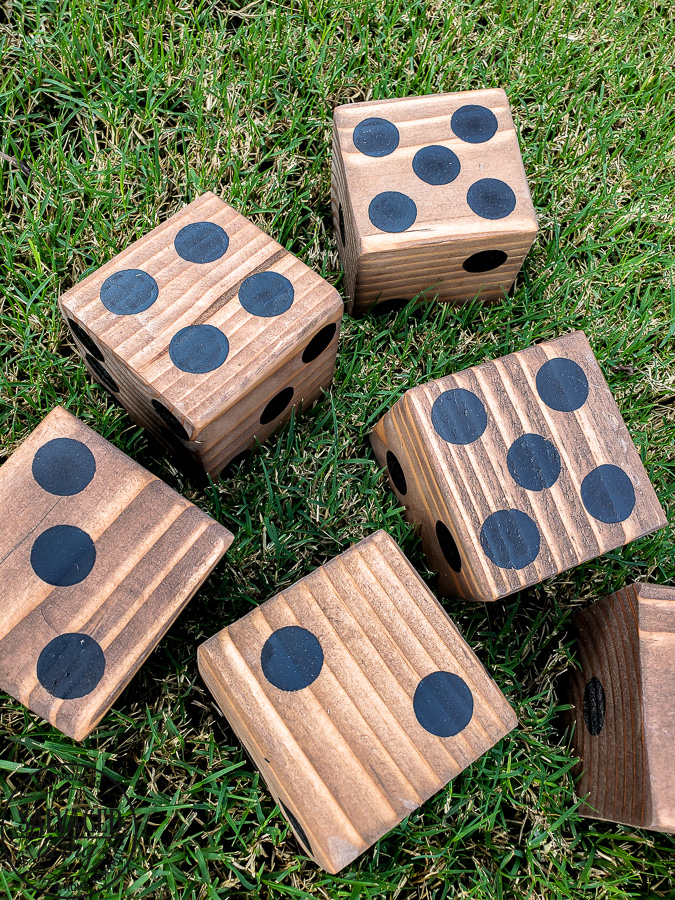 Learn how to make the perfect lawn dice for your outdoor game collection. #gamenight #scrapwood #diygames #outdoorideas