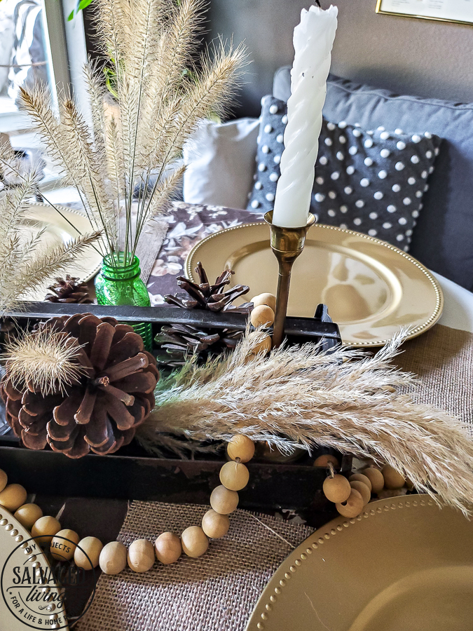 Rustic fall centerpiece idea for your fall decorating on a budget. Use nature and thrifted finds in your fall decor line up for a worn. warm, cozy fall vibe. #fallbudgetdecor #decoratinideas #cozyfall #simplefalldecor