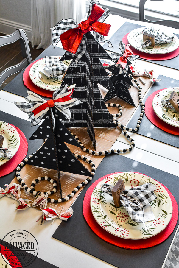 Amazing budget friendly Christmas decorating ideas including a chalkboard Christmas tree made out of cardboard. Cardboard craft ideas to use in your holiday decorating that are so adorable, like a glittery plate charger, ribbon table runner and more ideas to try. #buffalocheck #chalkboardcraft #DIYChristmas #cardboardcraft