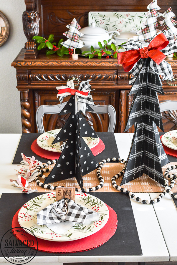 Amazing budget friendly Christmas decorating ideas including a chalkboard Christmas tree made out of cardboard. Cardboard craft ideas to use in your holiday decorating that are so adorable, like a glittery plate charger, ribbon table runner and more ideas to try. #buffalocheck #chalkboardcraft #DIYChristmas #cardboardcraft