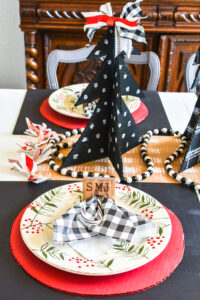 Learn how to make DIY personalized wood napkin rings for the cutest tablescape decor. Perfect napkin rings for your Christmas table or farmhouse decor! Budget decorating solution for a large table setting and extra special because they are monogrammed place holders! #tablescape #DIYtabledecor #monorgam #woodburning #napkinring