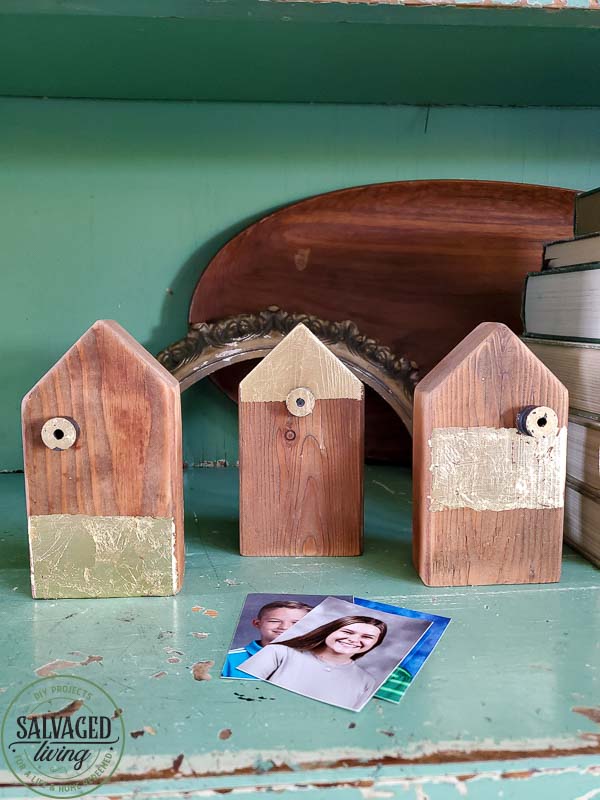 Make your own scrap wood picture holder house with this easy DIY that takes home made up anotch with gold leaf gilding for a modern touch on rustic charm for a great way to display kid's school pictures in style! #schoolpicture #scrapwoodproject #pictureframeidea #goldleafproject