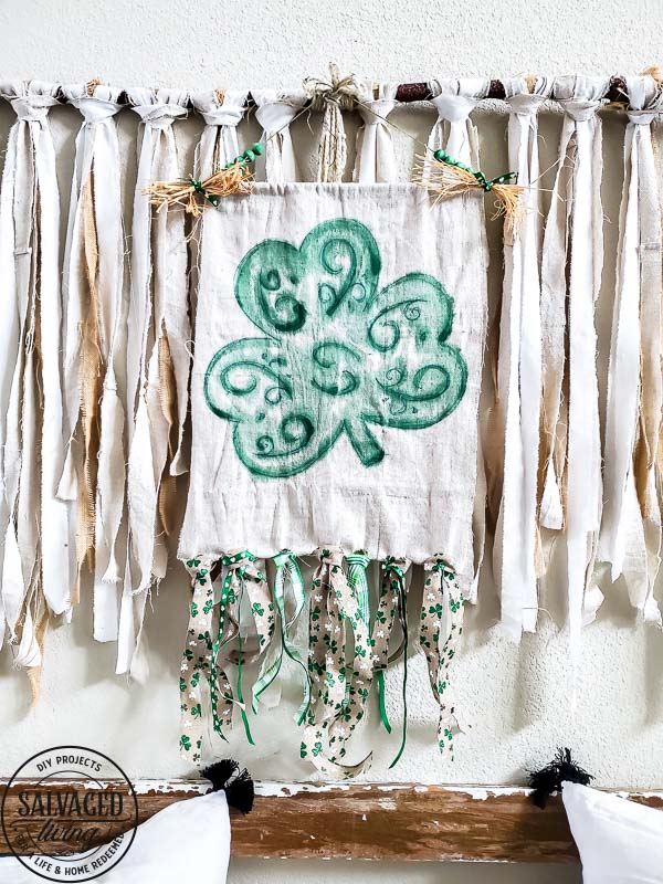 Use a dollar store felt shamrock for an easy St. Patrick's Day craft - this St. Paddy's Day banner is a beautiful watercolor shamrock idea you can DIY to decorate for St. Patrick's Day! #StPatricksDaydecor 