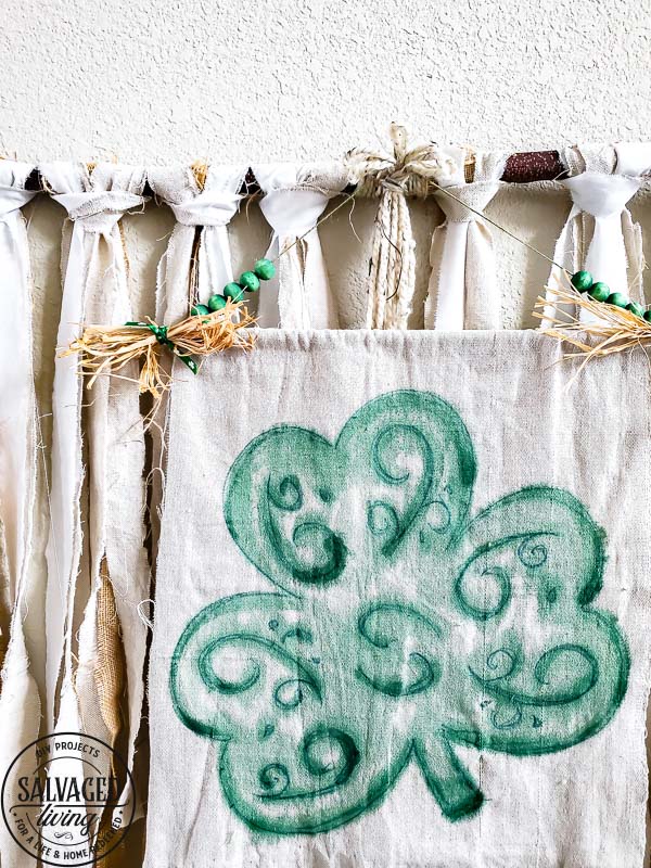 Use a dollar store felt shamrock for an easy St. Patrick's Day craft - this St. Paddy's Day banner is a beautiful watercolor shamrock idea you can DIY to decorate for St. Patrick's Day! #StPatricksDaydecor 