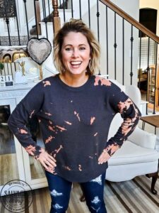 Learn how to bleach tie dye a sweatshirt with this simple video tutorial. Get a trendy bleach dyed shirt on a budget when you DIY it. This crafty clothing project is perfect to do with friends, family and kids. #bleachdye #tiedye #walmartclothing #budgetclothing