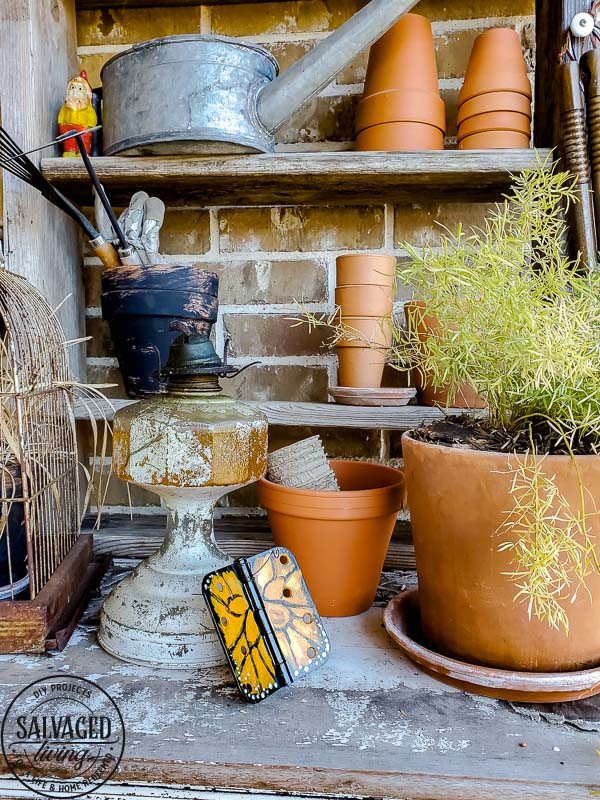 Wonder what to do with old door hinges? Try this upcycled door hinge butterfly project for a fun and beautiful addition to your spring decor ideas. These painted butterflies are perfect for your patio and potted plants. Truly adorable yard art you can DIY with thrifted or left over materials! #butterflyart #doorhinge #upcycledcraft #springdecor #springcraft