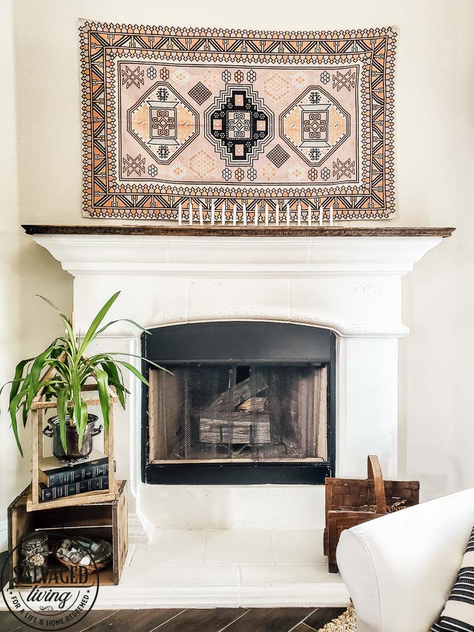 See how to make a stone fireplace mantel into a wood fireplace mantel. This DIY mantel idea is perfect for the person who loves to decorate their mantel but struggles with how to hang deocr on stone mantel or concrete mantel. It is an easy fireplace fix for a more functional fireplace mantel. #woodmantel #DIYmantel #manteldecor #stonefireplaceidea