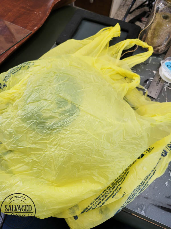 How to make adorable plastic grocery sack flowers for decorating your home on a budget. This plastic bag craft is so easy to make, budget friendly and gorgeous. No one will ever know you make these beautiful faux flowers from plastic bags! #grocerybagmakeover #plasticbagcraft #DIYfauxflower #budgetdecorideas