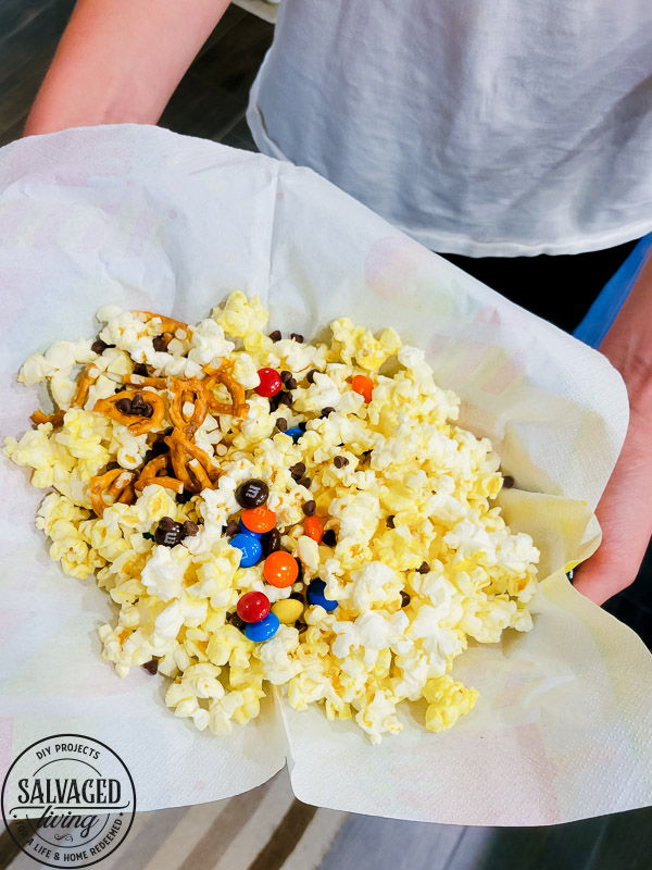 Get a free print out shopping list of the most amazing toppings for a gourmet popcorn bar. A popcorn bar is perfect for entertaining a crowd, it covers all the bases - salty, sweet, savory and sour. I have a list of the perfect popcorn bar ideas for you here! #popcron #crowdpleaser