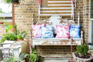 Create easy tie dye pillows with Testors fabric spray paint. This less mess tie-dye technique is so much easier than traditional tie-dye and gives you the same effect. This fabric paint dries soft and looks amazing for your holiday decor and pillows. Try this easy fabric craft for a multitude of craft ideas. #testors #testorscraft #crafttherapy #tiedye #fabricpainting #pillow #tiedyemethod #tiedyetechnique