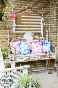 Create easy tie dye pillows with Testors fabric spray paint. This less mess tie-dye technique is so much easier than traditional tie-dye and gives you the same effect. This fabric paint dries soft and looks amazing for your holiday decor and pillows. Try this easy fabric craft for a multitude of craft ideas. #testors #testorscraft #crafttherapy #tiedye #fabricpainting #pillow #tiedyemethod #tiedyetechnique