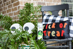 Create a spooky porch for Halloween with DIY glow-in-the-dark outdoor Halloween decor. Perfect for your plants and yard, these glow in the dark eyes bring your outdoor decorating to life! #rustoleum #rustoleumimagine #glowinthedark #halloween #halloweendecor #sponsored #outdoordecor #DIYHalloweencraft