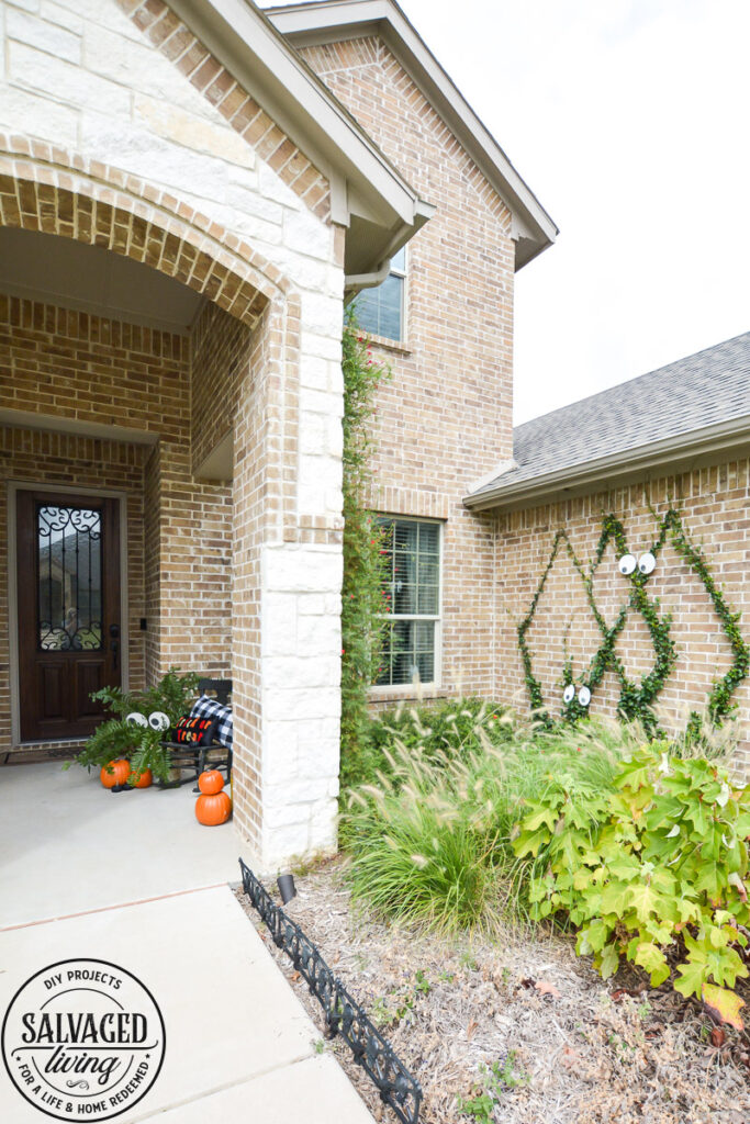 Create a spooky porch for Halloween with DIY glow-in-the-dark outdoor Halloween decor. Perfect for your plants and yard, these glow in the dark eyes bring your outdoor decorating to life! #rustoleum #rustoleumimagine #glowinthedark #halloween #halloweendecor #sponsored #outdoordecor #DIYHalloweencraft