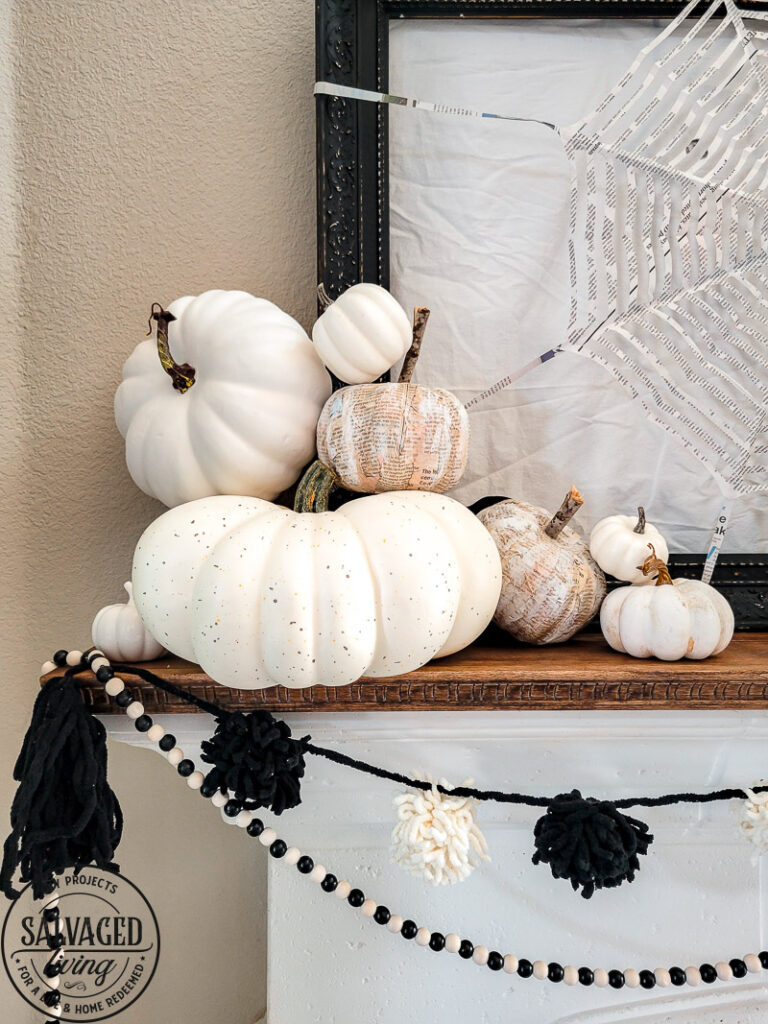 Three Halloween craft ideas to bring your Halloween mantel to life on a budget. These Halloween decor ideas are perfect for the crafty, budget friendly decorator to have a neautral farmhouse style Halloween decor that won't break the bank! Make a paper spider web, newspaper pumpkins and a precious witch's broom. #halloweenDIY #budgetHalloween #Halloweenpapercrafts