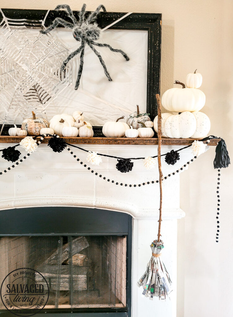 Three Halloween craft ideas to bring your Halloween mantel to life on a budget. These Halloween decor ideas are perfect for the crafty, budget friendly decorator to have a neautral farmhouse style Halloween decor that won't break the bank! Make a paper spider web, newspaper pumpkins and a precious witch's broom. #halloweenDIY #budgetHalloween #Halloweenpapercrafts