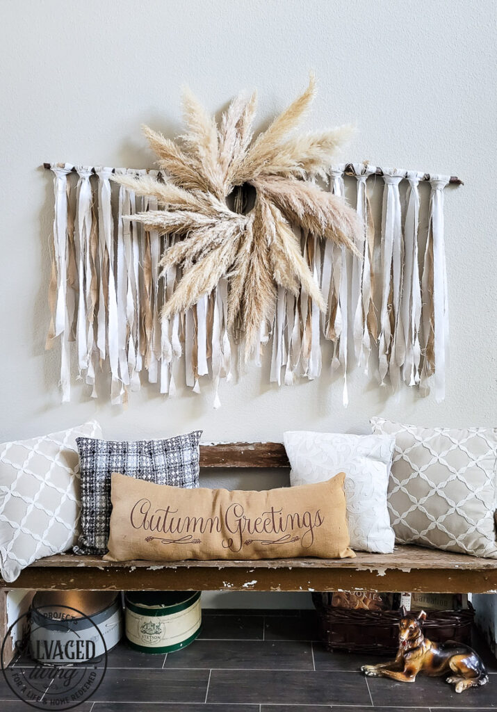 Learn how to make the large scale wall hanging I use in my living room. This shabby chic wall art is perfect fora large space or make it small and DIY this idea to fit your needs. Using an old sheet, burlap and drop cloth you can create a boho wall hanging in no time. #dropclothcraft #walldecor #wallartideas #DIYbohodecor