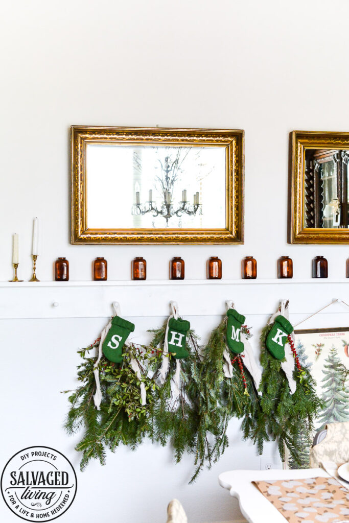 It's Christmas in the dining room, we decorated the peg board with vintage finds and real tree trimmings for an affordable and stylish Christmas feel on a budget. This peg board decorated for Christmas has all the holiday feels for a rustic, neutral Christmas decor vibe. #naturalChristmas #RusticChristmas #vintageChristmas #brownChristmas