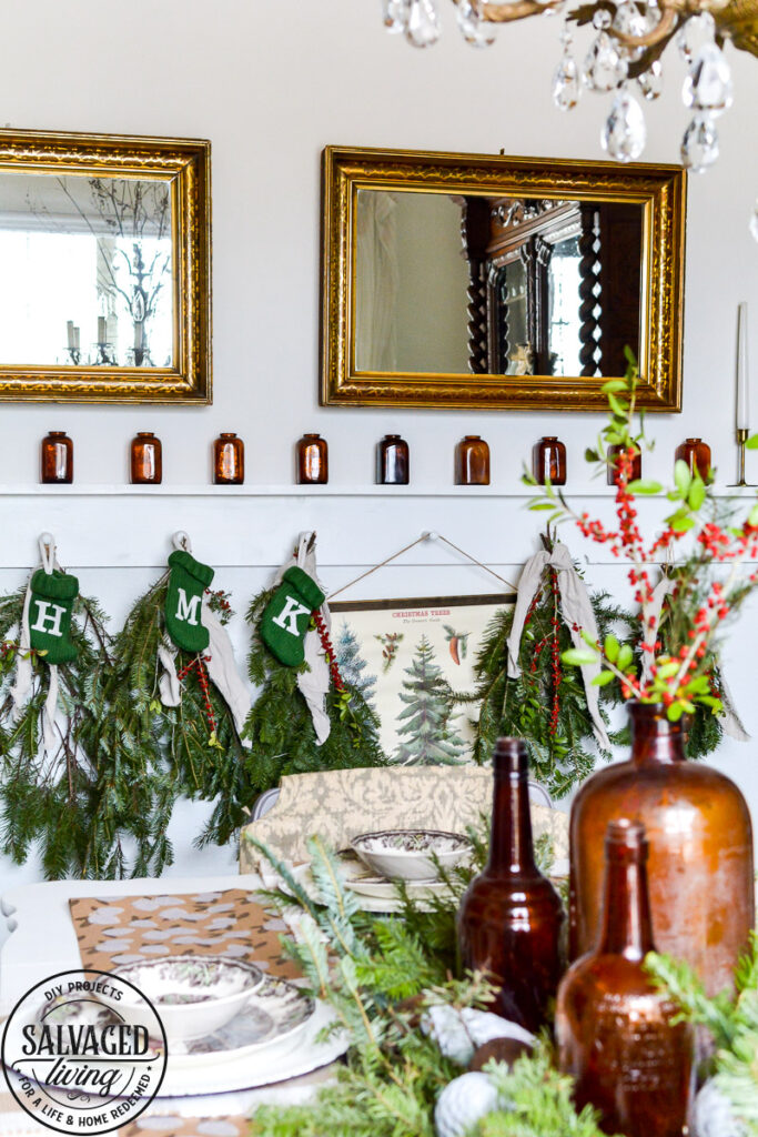 It's Christmas in the dining room, we decorated the peg board with vintage finds and real tree trimmings for an affordable and stylish Christmas feel on a budget. This peg board decorated for Christmas has all the holiday feels for a rustic, neutral Christmas decor vibe. #naturalChristmas #RusticChristmas #vintageChristmas #brownChristmas