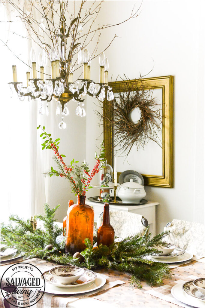 It's Christmas in the dining room, we decorated the peg board with vintage finds and real tree trimmings for an affordable and stylish Christmas feel on a budget. This peg board decorated for Christmas has all the holiday feels for a rustic, neutral Christmas decor vibe. #naturalChristmas #RusticChristmas #vintageChristmas #brownChristmas