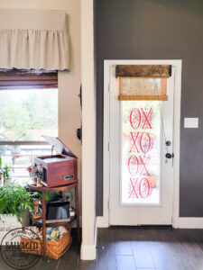 Get ideas for a simple Valentine's Day table you can create with a dollar store item and fun layering. A Valentine's Day table doesn't have to cost a lot, it can be cheap and cute! #valentinesdayinspiration #valentinesdaydollarstore #valentinesdecorideas