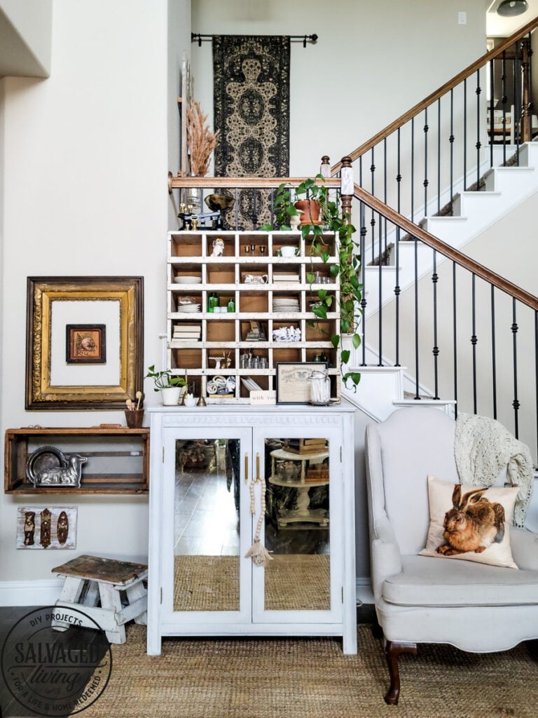 How to decorate a vintage cubby, including an idea list of what to decorate your vintage cubby with! These old sirting cabinets and storage units make for cozy decor that let you show of your favorite treasures and found items! #vintagedecor #howtodecorate #famhousedecoridea