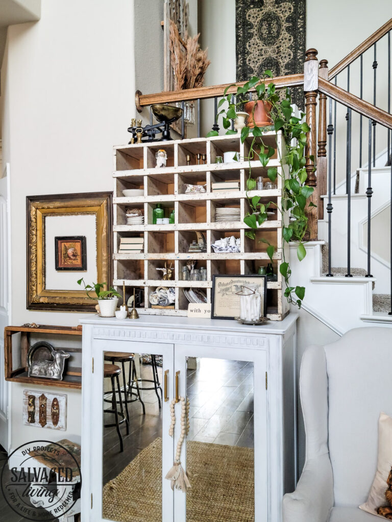 How to decorate a vintage cubby, including an idea list of what to decorate your vintage cubby with! These old sirting cabinets and storage units make for cozy decor that let you show of your favorite treasures and found items! #vintagedecor #howtodecorate #famhousedecoridea