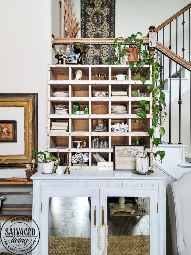How to decorate a vintage cubby, including an idea list of what to decorate your vintage cubby with! These old sirting cabinets and storage units make for cozy decor that let you show of your favorite treasures and found items! #vintagedecor #howtodecorate #famhousedecoridea