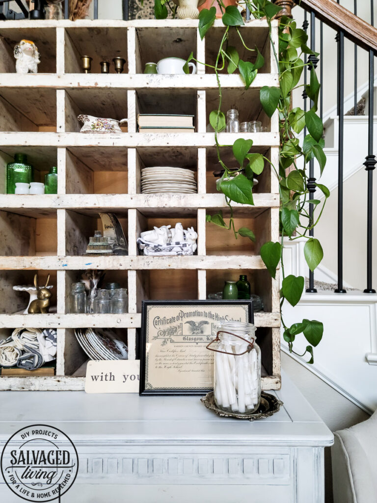 How to decorate a vintage cubby, including an idea list of what to decorate your vintage cubby with! These old sirting cabinets and storage units make for cozy decor that let you show of your favorite treasures and found items! #vintagedecor #howtodecorate #famhousedecoridea