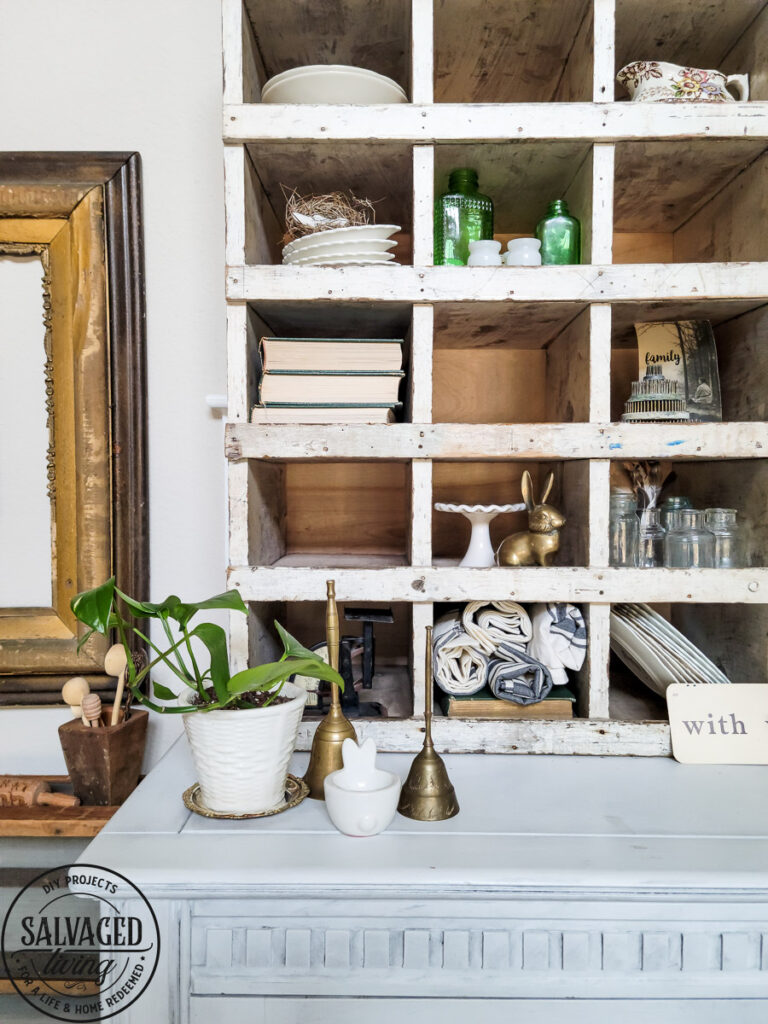 How to decorate a vintage cubby, including an idea list of what to decorate your vintage cubby with! These old sirting cabinets and storage units make for cozy decor that let you show of your favorite treasures and found items! #vintagedecor #howtodecorate #famhousedecoridea