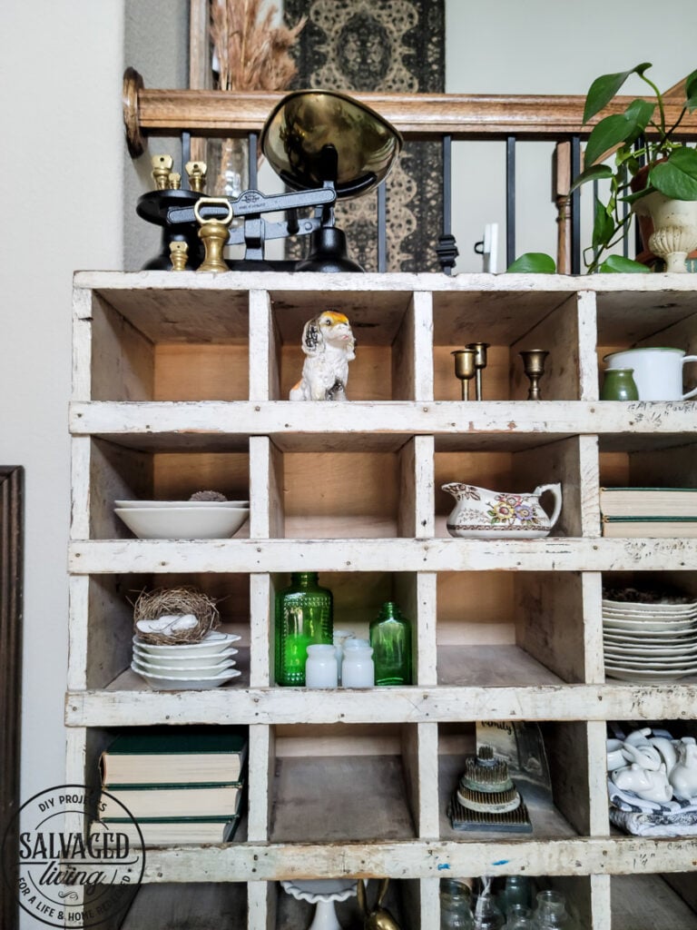 How to decorate a vintage cubby, including an idea list of what to decorate your vintage cubby with! These old sirting cabinets and storage units make for cozy decor that let you show of your favorite treasures and found items! #vintagedecor #howtodecorate #famhousedecoridea