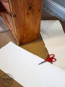 See how to make a DIY embossed leather look to add to walls, craft projects or furniture for a beautoful and unique makeover technique. Use Modern Masters tintable glaze to achieve a deep, rustic, worn leather look on textured wallpaper! #leatherlook #furnituremakeover #garagesalemakeover #Modernmasters