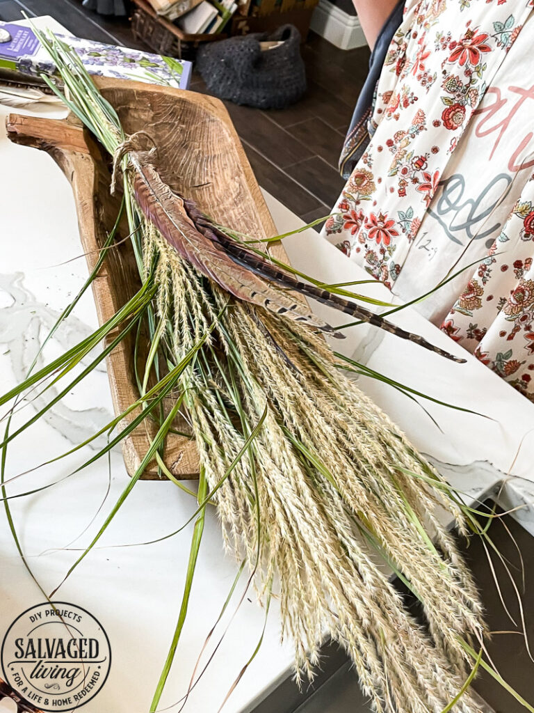 how to decorate a dough bowl with nature and vintage items. Here are 19 ways to decorate your dough bowl for a rustic vintage farmhouse style. These versatile decorating ideas are sure to give you lots of dough bowl inspiration. #doughbowldecor #vignetteideas #smallspacedecor #vintagedecor #cozyhome