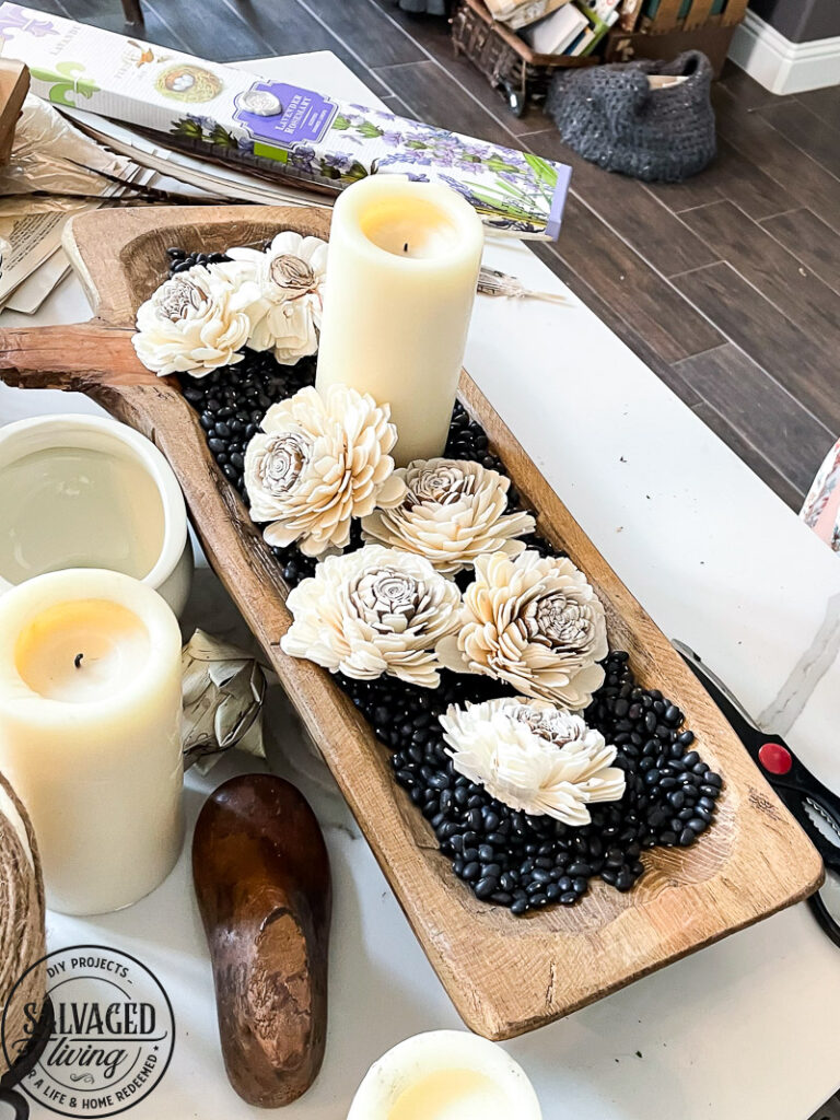 how to decorate a dough bowl with nature and vintage items. Here are 19 ways to decorate your dough bowl for a rustic vintage farmhouse style. These versatile decorating ideas are sure to give you lots of dough bowl inspiration. #doughbowldecor #vignetteideas #smallspacedecor #vintagedecor #cozyhome