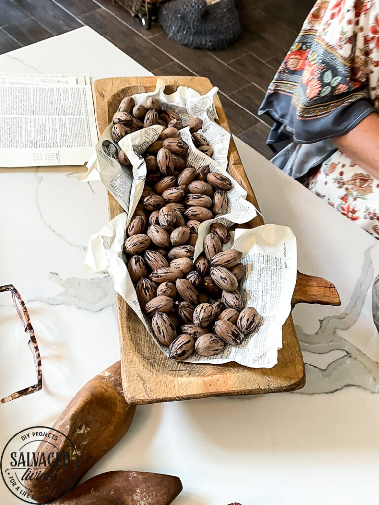 how to decorate a dough bowl with nature and vintage items. Here are 19 ways to decorate your dough bowl for a rustic vintage farmhouse style. These versatile decorating ideas are sure to give you lots of dough bowl inspiration. #doughbowldecor #vignetteideas #smallspacedecor #vintagedecor #cozyhome