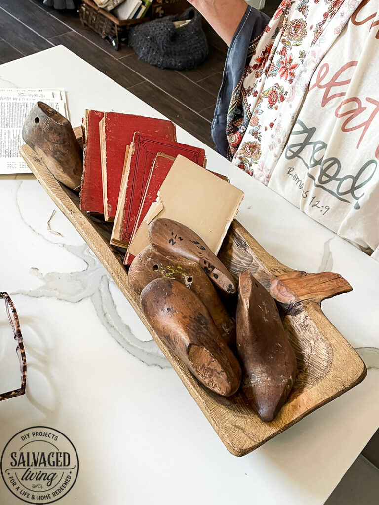 how to decorate a dough bowl with nature and vintage items. Here are 19 ways to decorate your dough bowl for a rustic vintage farmhouse style. These versatile decorating ideas are sure to give you lots of dough bowl inspiration. #doughbowldecor #vignetteideas #smallspacedecor #vintagedecor #cozyhome