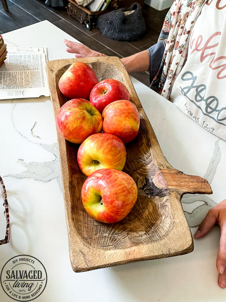 how to decorate a dough bowl with nature and vintage items. Here are 19 ways to decorate your dough bowl for a rustic vintage farmhouse style. These versatile decorating ideas are sure to give you lots of dough bowl inspiration. #doughbowldecor #vignetteideas #smallspacedecor #vintagedecor #cozyhome