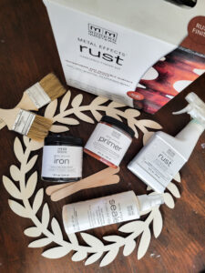 Learn how to rust wood or rust any surface with this amazing product and technique. Rust new things like wood and dollar store bells for gorgeous decor that feels old and vintage. You can make new things old with rust! #DIYdecor #rustychippy #rustfinish #painting technique #paintideas