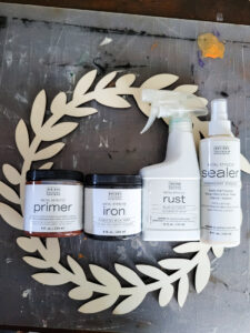Learn how to rust wood or rust any surface with this amazing product and technique. Rust new things like wood and dollar store bells for gorgeous decor that feels old and vintage. You can make new things old with rust! #DIYdecor #rustychippy #rustfinish #painting technique #paintideas