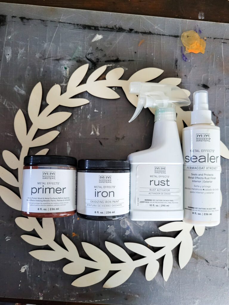 Learn how to rust wood or rust any surface with this amazing product and technique. Rust new things like wood and dollar store bells for gorgeous decor that feels old and vintage. You can make new things old with rust! #DIYdecor #rustychippy #rustfinish #painting technique #paintideas