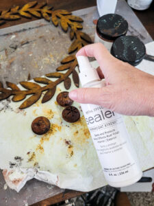 Learn how to rust wood or rust any surface with this amazing product and technique. Rust new things like wood and dollar store bells for gorgeous decor that feels old and vintage. You can make new things old with rust! #DIYdecor #rustychippy #rustfinish #painting technique #paintideas